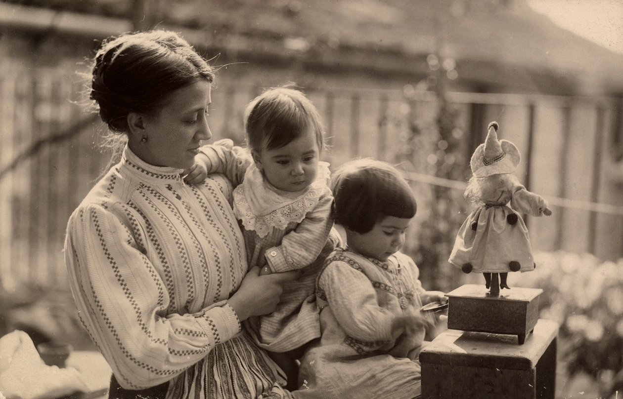 Woman with babies and doll by Phillipe de Marlier